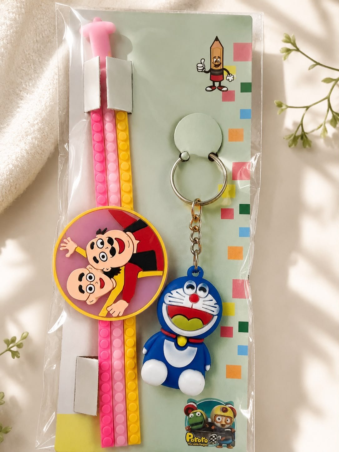 Motu Patlu Silicone Slap Band Rakhi with Doraemon Keychain for Kids,LED Light & Roli Tikka | Raksha Bandhan Gift - Image 2