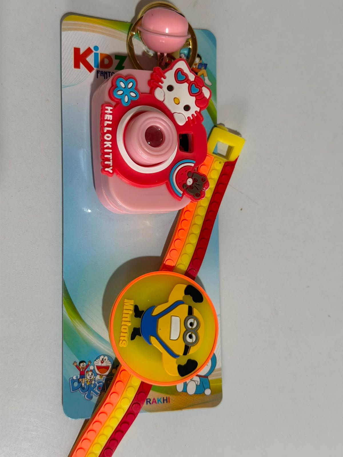 Minions Kids Rakhi Gift Set with Mini Camera Keychain,Light Projector & Adjustable Silicone Wrist Band with LED Light