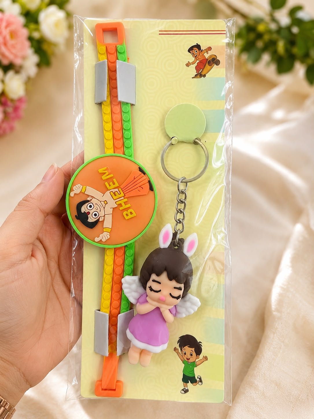 Chhota Bheem Silicone Slap Band Rakhi with Angel Girl Keychain for Kids,LED Light & Roli Tikka | Raksha Bandhan Gift - Image 2