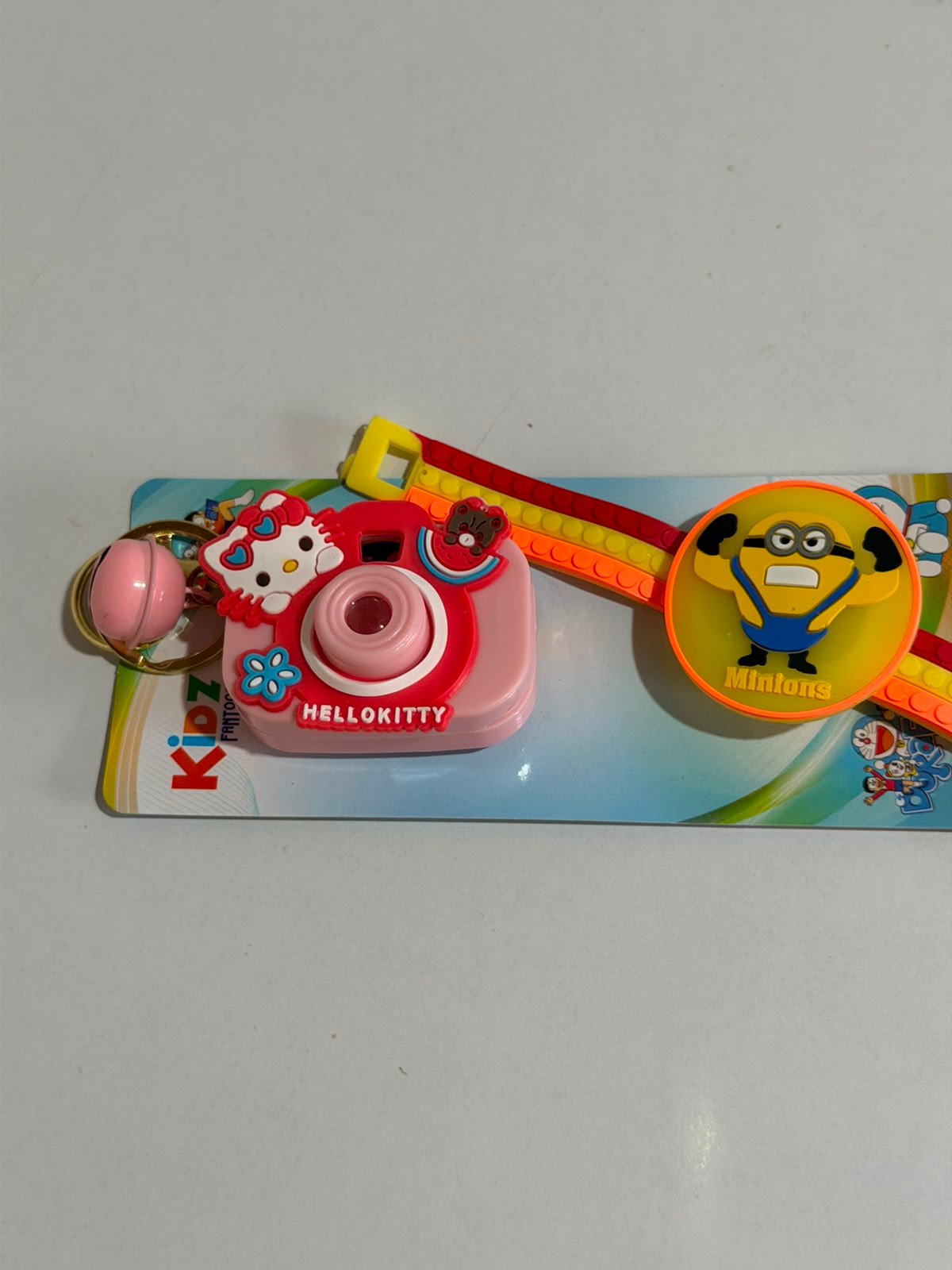 Minions Kids Rakhi Gift Set with Mini Camera Keychain,Light Projector & Adjustable Silicone Wrist Band with LED Light - Image 2