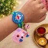 Doraemon Kids Rakhi Gift Set with Mini Camera Keychain, Light Projector & Adjustable Silicone Wrist Band with LED Light